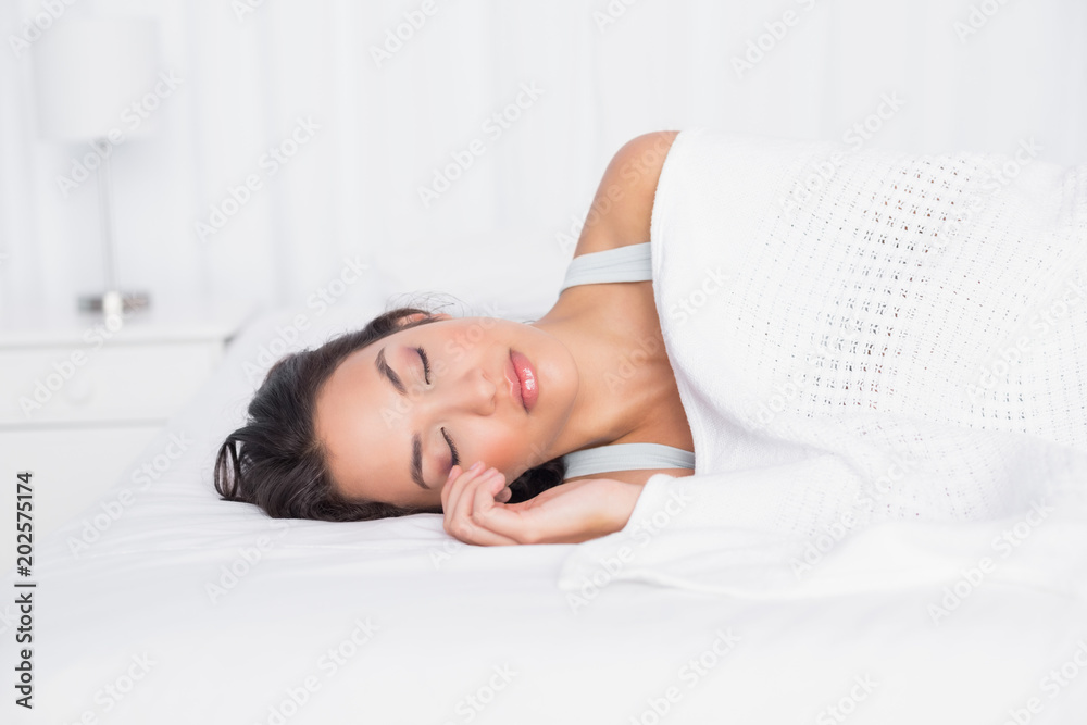 Pretty young woman sleeping with eyes closed in bed Pretty young woman sleeping with eyes closed in bed