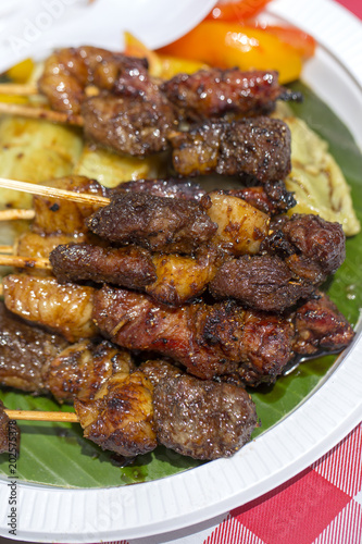 Indonesian grilled meats in wooden skewers, island Bali, Indonesia