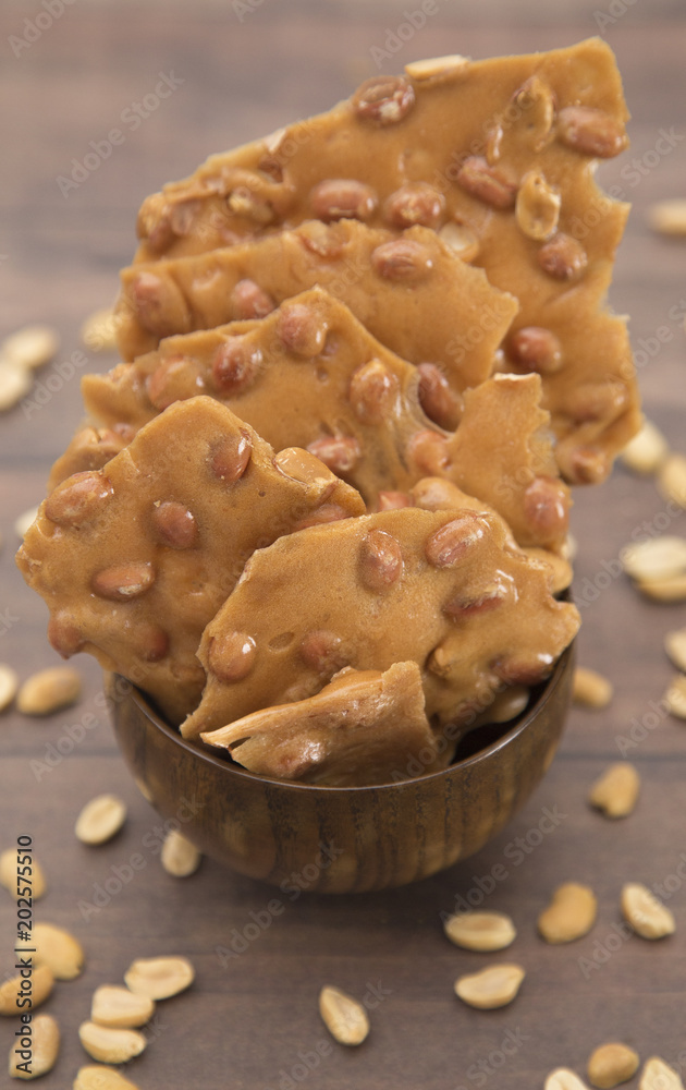 Classic Peanut Brittle on a Wooden Table