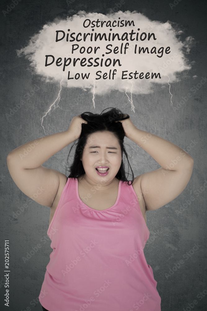 Fotografie Frustrated obese woman thinking her problems