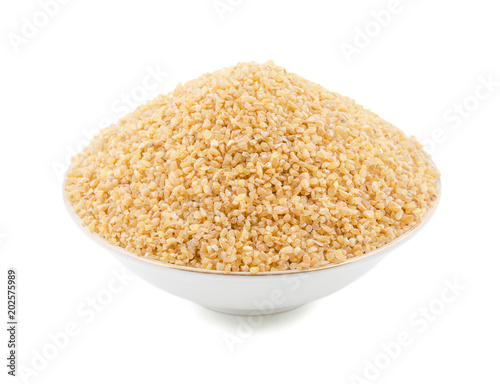 Raw Cereal Food Also Know as Bulgur, Dalia or Daliya Isolated on White Background photo