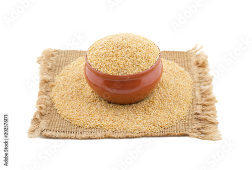 Raw Cereal Food Also Know as Bulgur, Dalia or Daliya Isolated on White Background photo