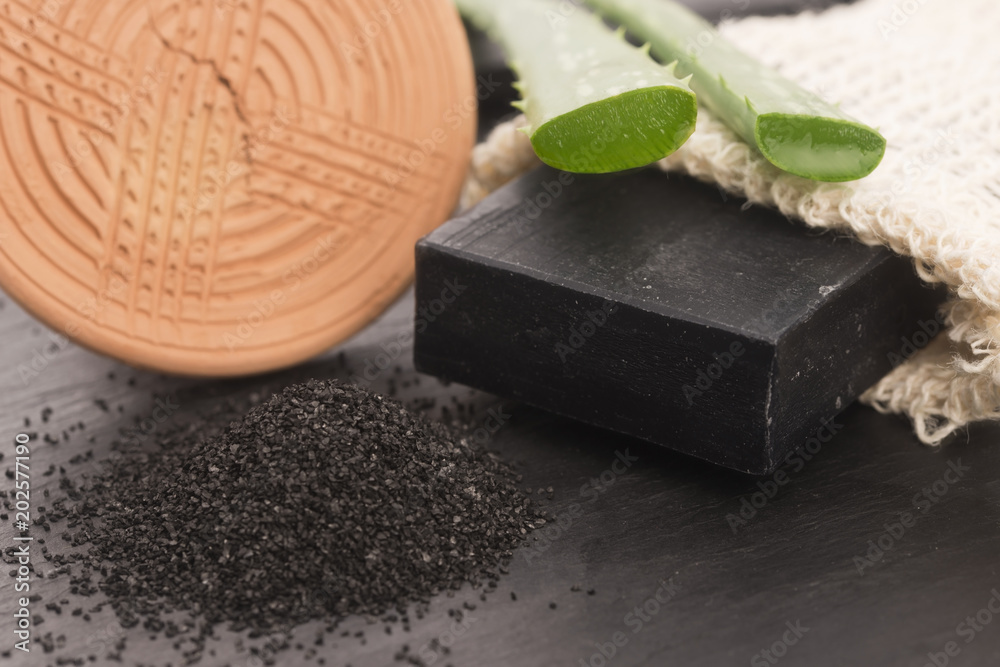 block of natural carbon soap with aloe vera