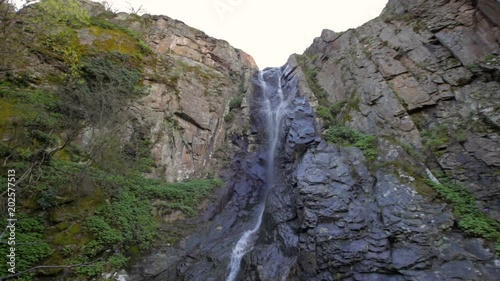 Small waterfall with a lot of vegetation photo