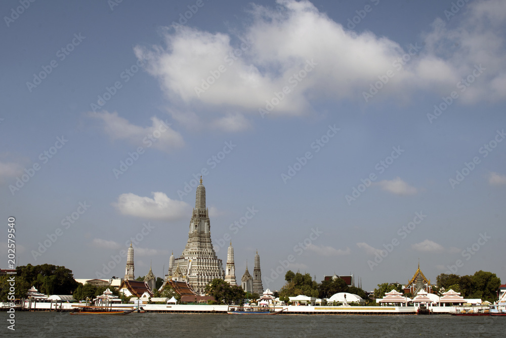 Wat Arun temple and Chao Phraya river in Bangkok, Thailand.