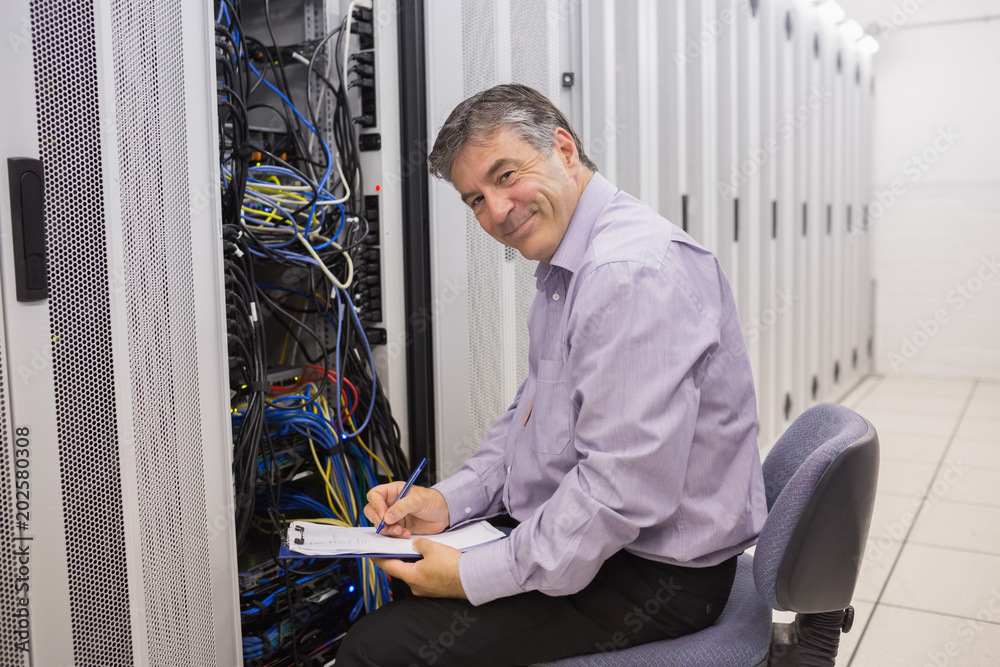 Fototapeta premium Happy technician repairing the server