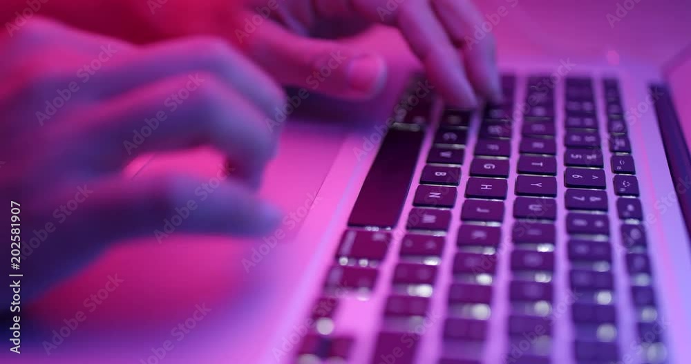 Typing on laptop computer keyboard