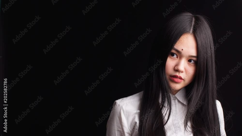 Beautiful Asian woman with red lips posing on isolated background. Beautiful Asian woman with red lips posing on isolated background.