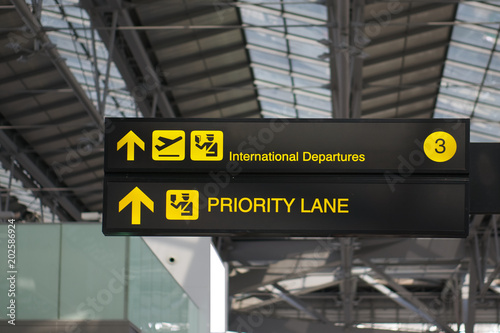 Wallpaper Mural Departure and priority lane board sign at international airport Torontodigital.ca