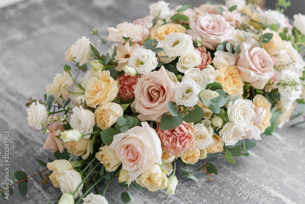 Flower arrangement on gray table. Stylish decor and adorning. Flower arrangement on gray table. Stylish decor and adorning.
