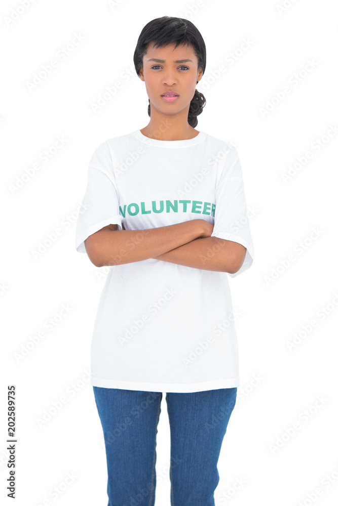 Fototapeta premium Depressed black haired volunteer posing with crossed arms