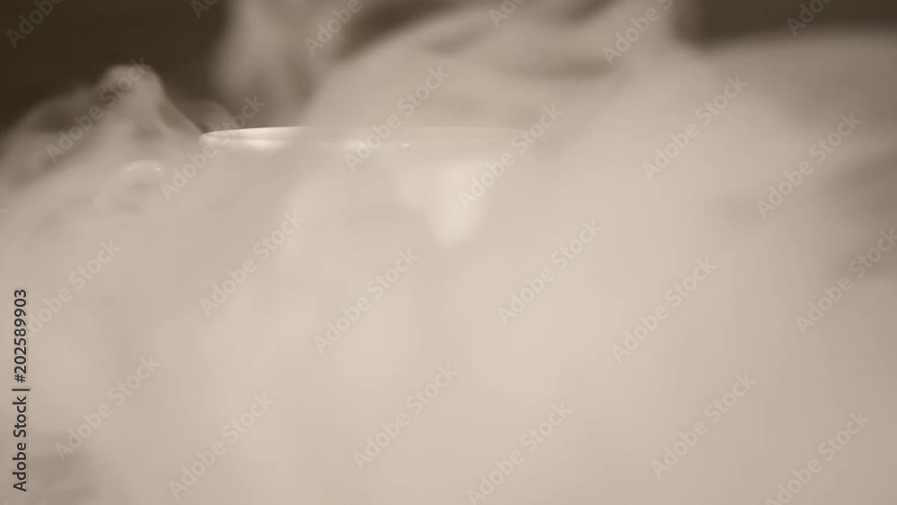 Smoke blows on a white cup with coffee, Smoke blows on a white cup with coffee,