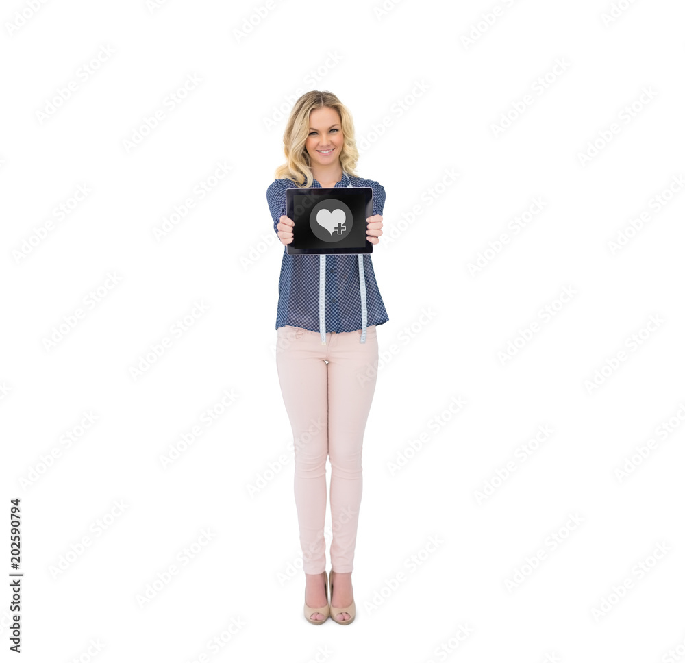heart against happy pretty fashion designer showing tablet heart against happy pretty fashion designer showing tablet