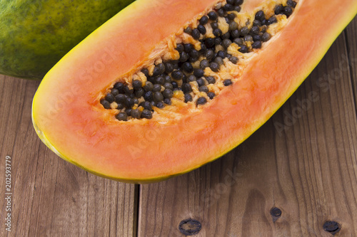 slice of papaya on the wooden table