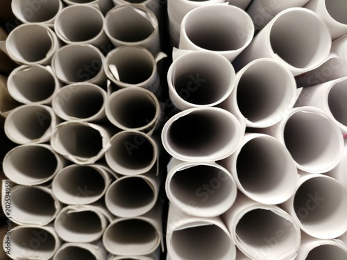 rolls of tracing paper from top view, look like many deep dark holes opening next to each other