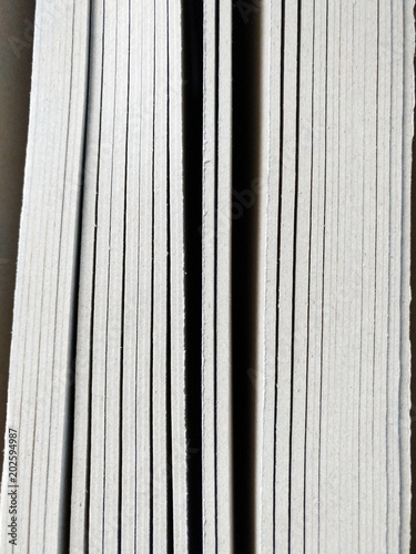 hard board lined up in shelf making variety of vertical bar lines