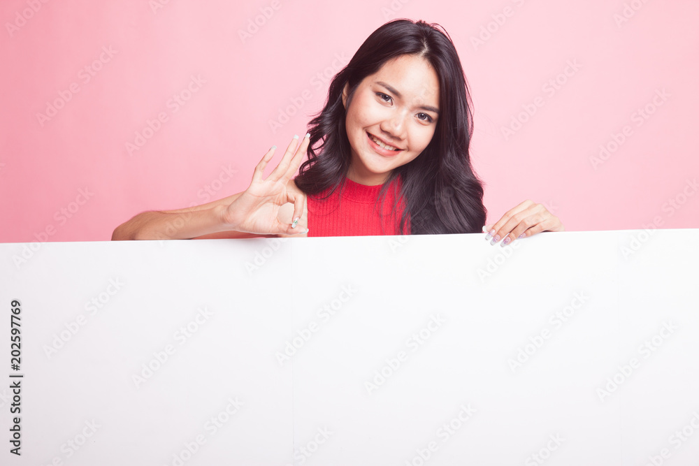 Young Asian woman show OK with blank sign. Young Asian woman show OK with blank sign.