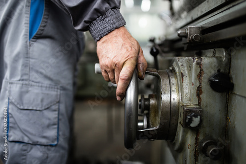 Metallurgy heavy industry. Factory for production of special industrial tools. Worker hands close up.