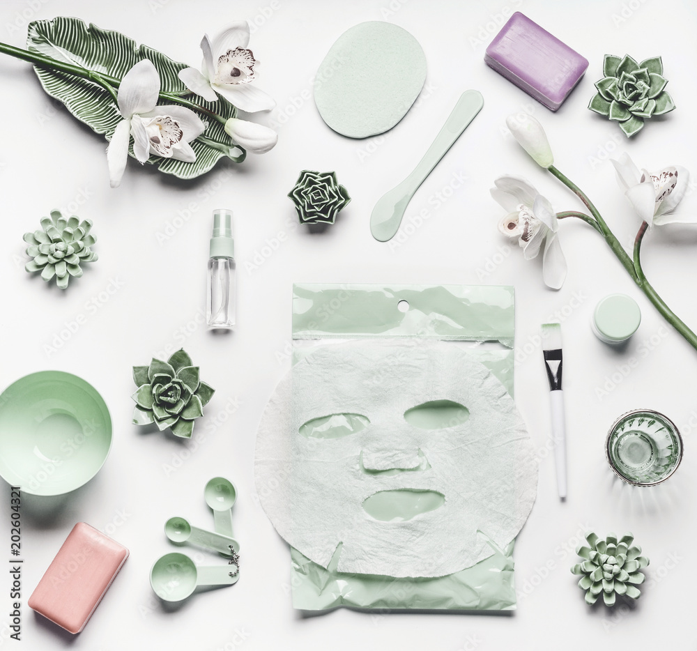 selvfølgelig Norm Betjene Green skin care cosmetic setting with orchid flowers, accessories and facial  calming sheet mask on white background, top view, frame, flat lay. Beauty  concept Stock Photo | Adobe Stock