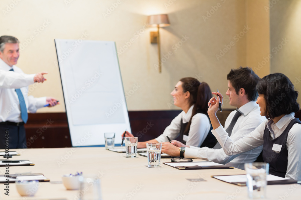 Fototapeta premium Woman asking question during business presentation