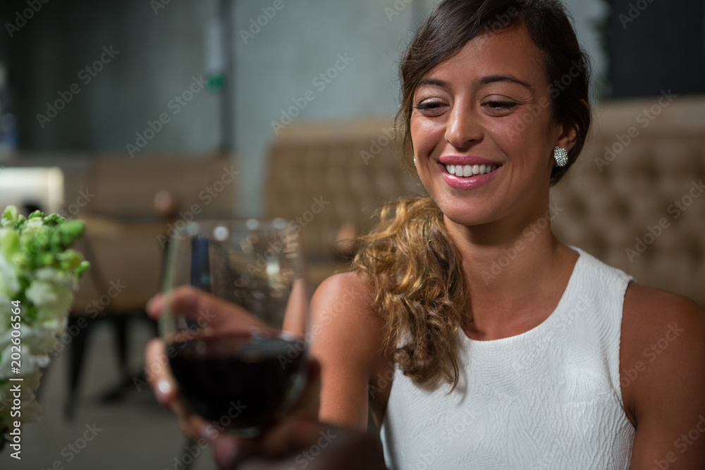 Beautiful woman having red wine