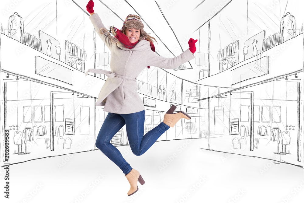 Happy blonde in winter clothes posing against sketch design of a mall Happy blonde in winter clothes posing against sketch design of a mall