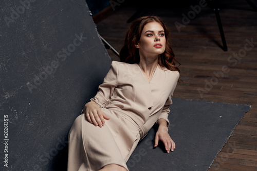 woman model lying on the floor in a dress