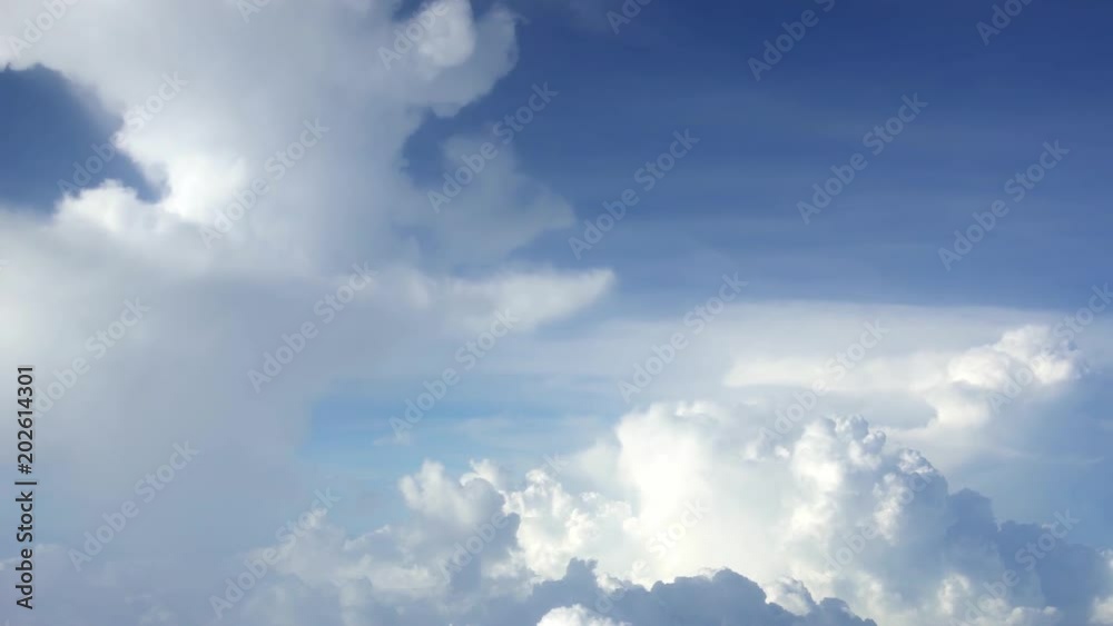 4K Traveling by air. Wonderful view of the sky and clouds from above, as seen through an airplane window. Plane in flight trip and beautiful views from the perspective of the traveler in the cabin-Dan 4K Traveling by air. Wonderful view of the sky and clouds from above, as seen through an airplane window. Plane in flight trip and beautiful views from the perspective of the traveler in the cabin-Dan