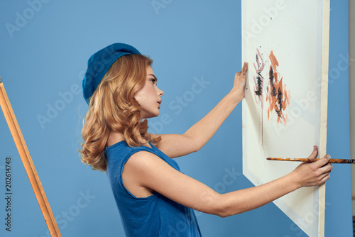 girl in dress on wall