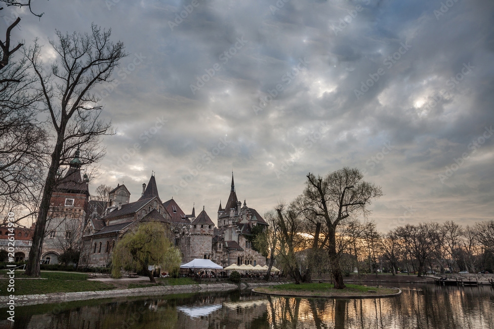 Vajdahunyad Castle in front of a lake in Varosliget Park (the city park) in Budapest, Hungary. Located near Szechenyi bath, it is one of the main monuments of the city.