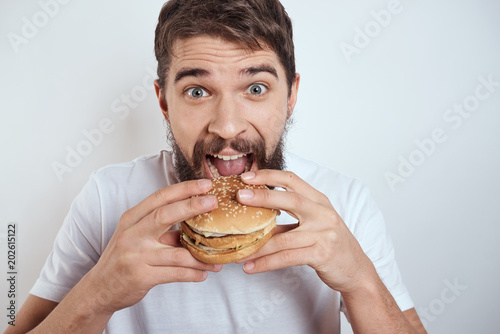 young woman eating hamburger