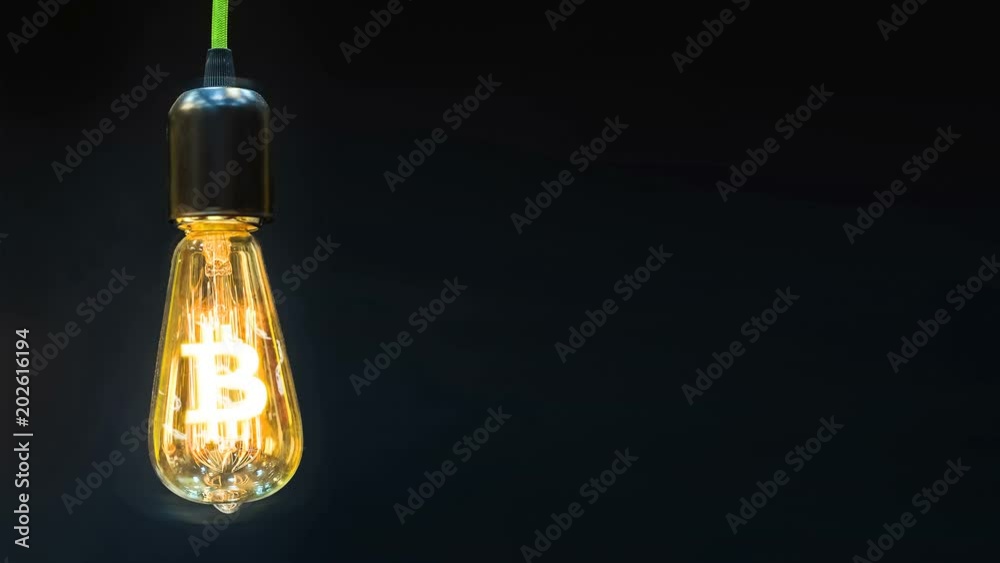 The sign of the crypto bitcoin currency is inside of the retro lamps. The sign of the crypto bitcoin currency is inside of the retro lamps.