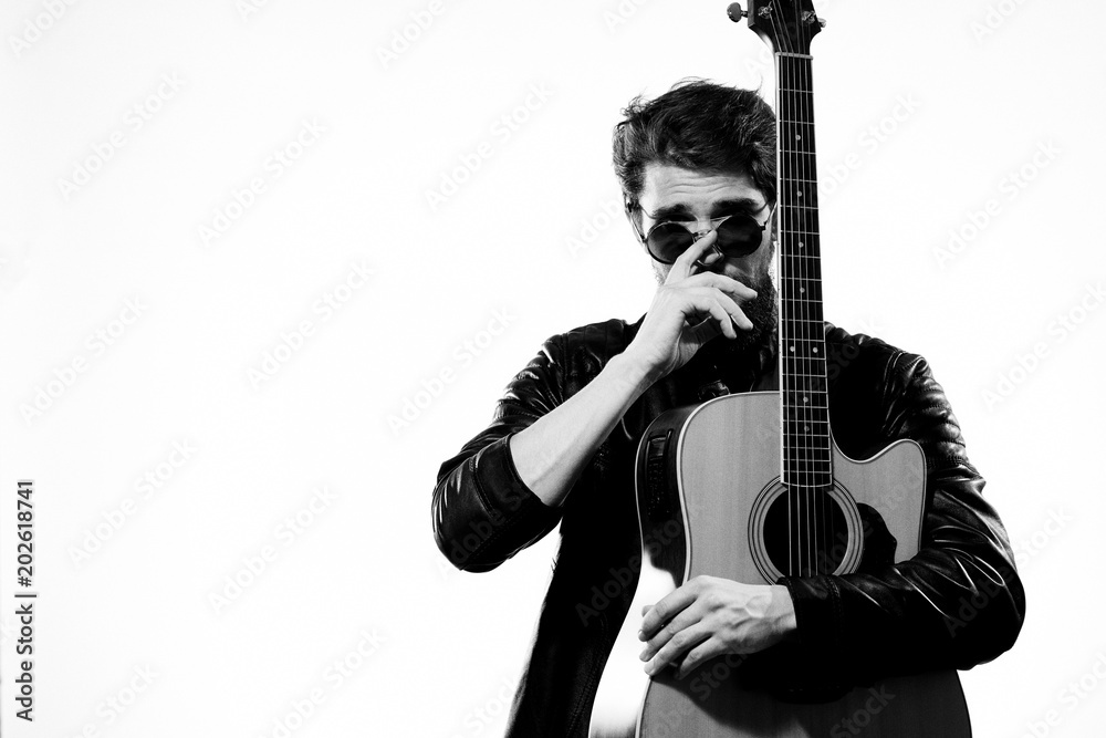 man with guitar on bright background