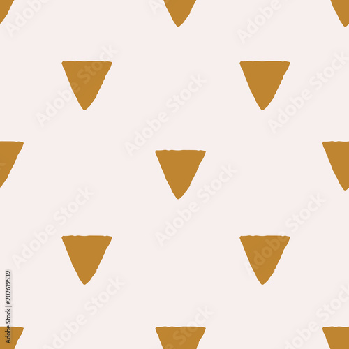 Gold triangular background on pastel pink. Seamless grunge geometric pattern. Cute abstract triangle geometrical background. Vector illustration.