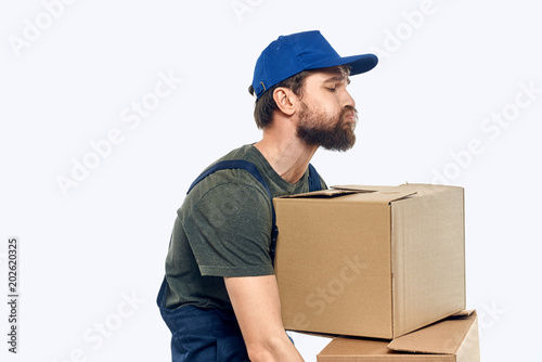 delivery man carrying boxes