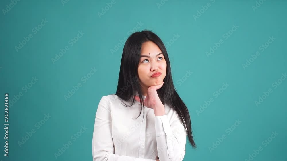 Crazy Portrait of beautiful young asian girl with long black hair. Slow motion. Crazy Portrait of beautiful young asian girl with long black hair. Slow motion.