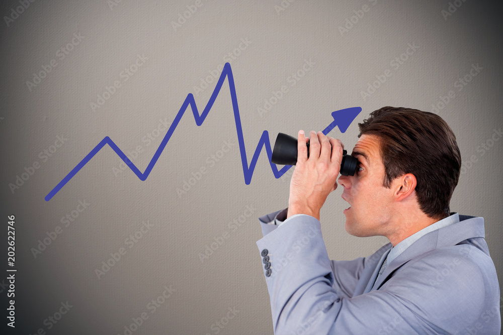 Visionary businessman looking to the future against digitally generated grey vignette background Visionary businessman looking to the future against digitally generated grey vignette background