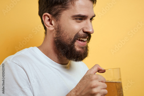 man drinking a glass of white wine