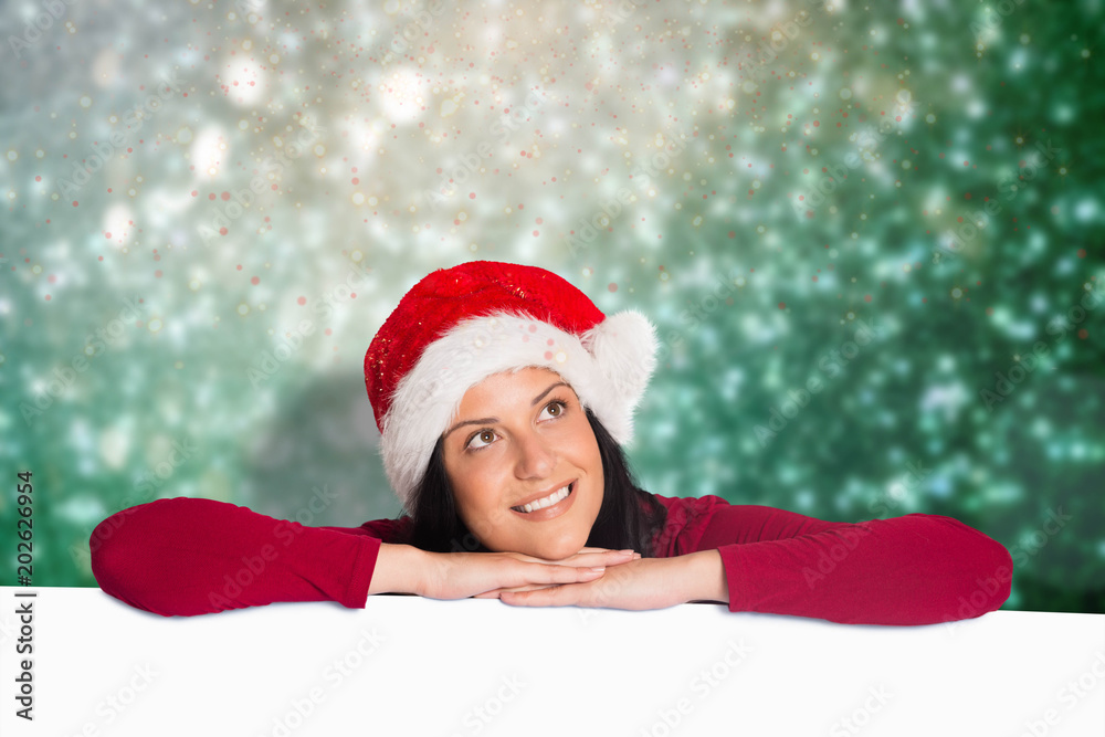 Woman smiling while looking away against blurred lights Woman smiling while looking away against blurred lights