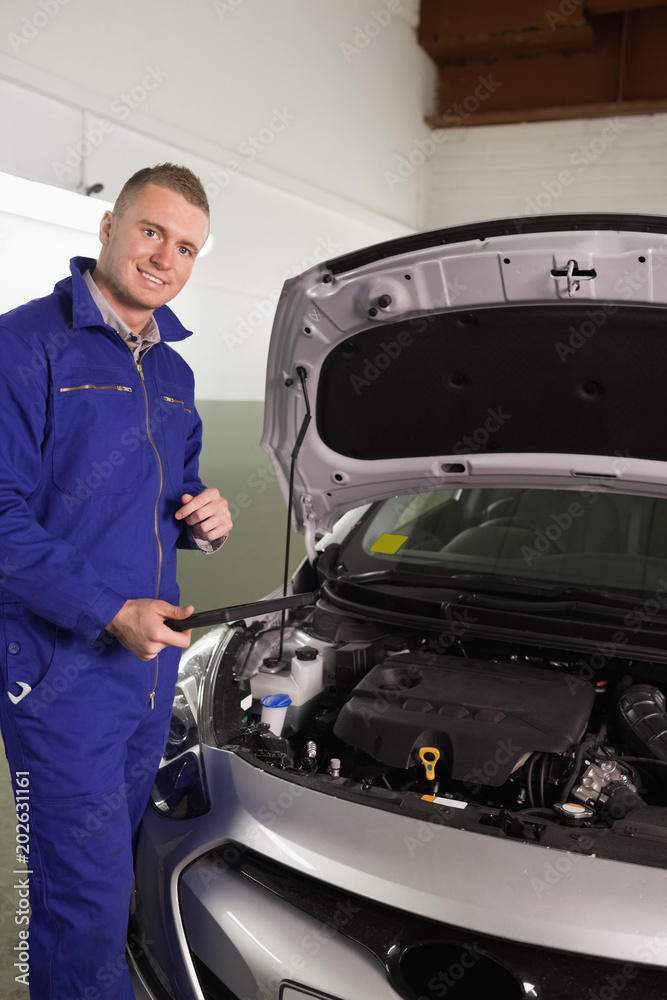 Mechanic holding a tablet computer Mechanic holding a tablet computer