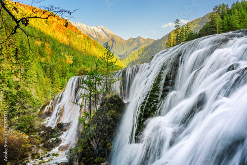 Scenic view of the Pearl Shoals Waterfall among wooded mountains