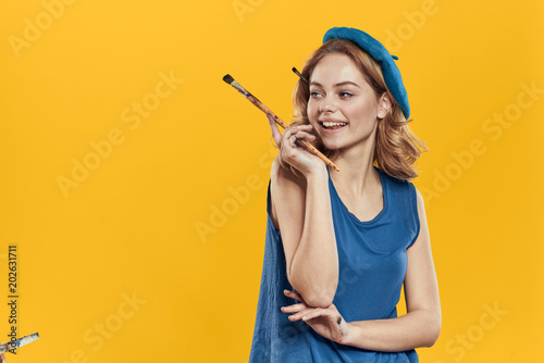artist with a brush on a yellow background