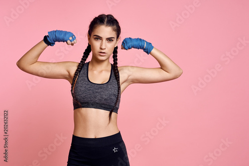 woman playing sports and blue ribbons on her hands