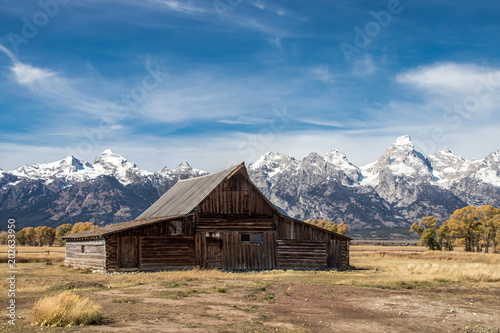 A barn on Mormon Row in Grand Teton National Park. In the background are the beautiful mountains of Wyoming, USA.