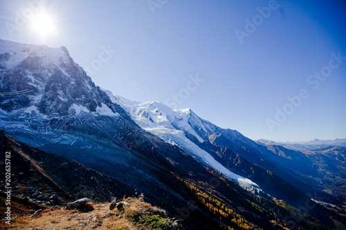 Vivid Sun in snowly mountains in Swiss near Geneva, blue sky, Eurone nature, stones and fresh air