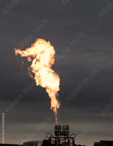 Fire erupting from hot air balloon burner photo