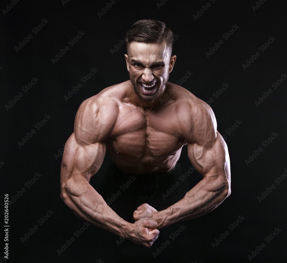 Scream of rage in the bodybuilder during training. Scream of rage in the bodybuilder during training.