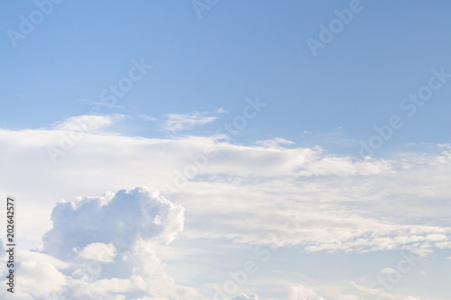 Large white Cumulus clouds on blue sky