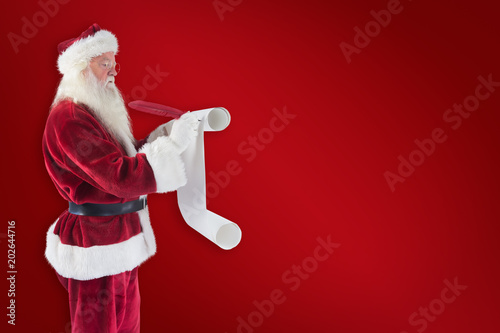 Father Christmas writes a list against red background