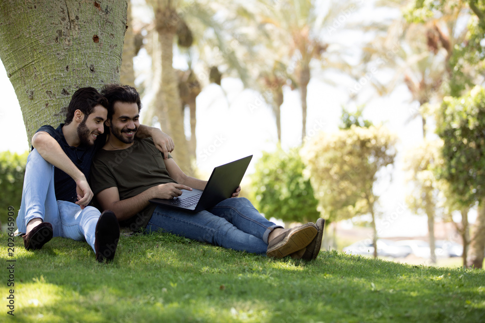 looking at the laptop together looking at the laptop together